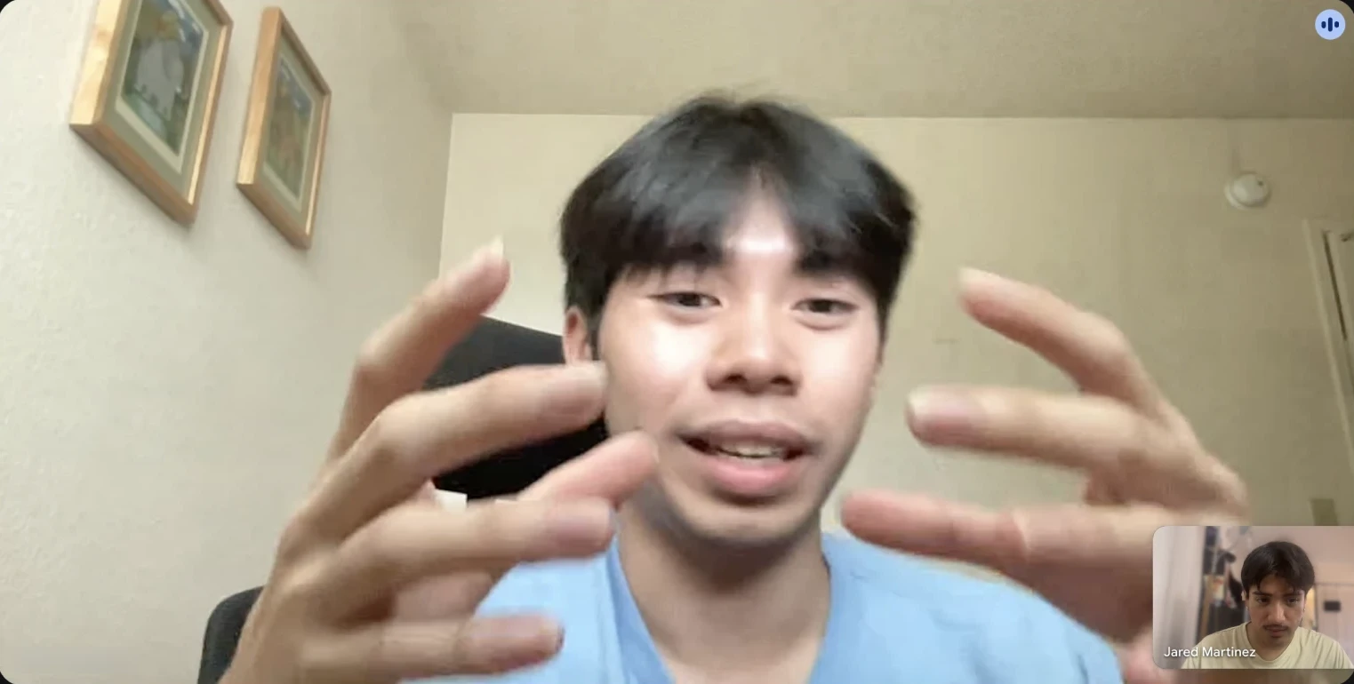 Google Meet interview with the club’s co-president, who is gesturing as he explains